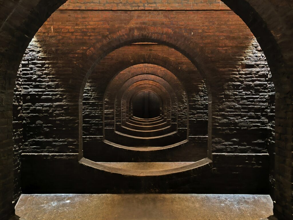 A shot through a series of brick structures. These are the wtare tanks under Žlutý kopec, Brno.