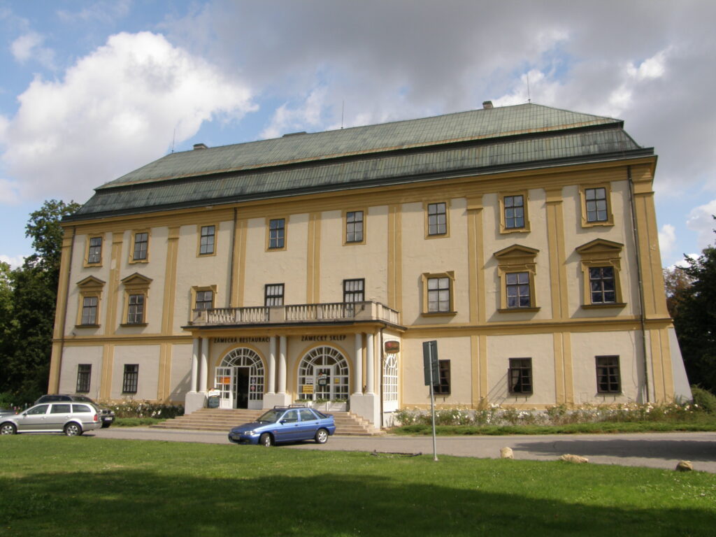 A large chateau in Zlín painted in pastel yellows.