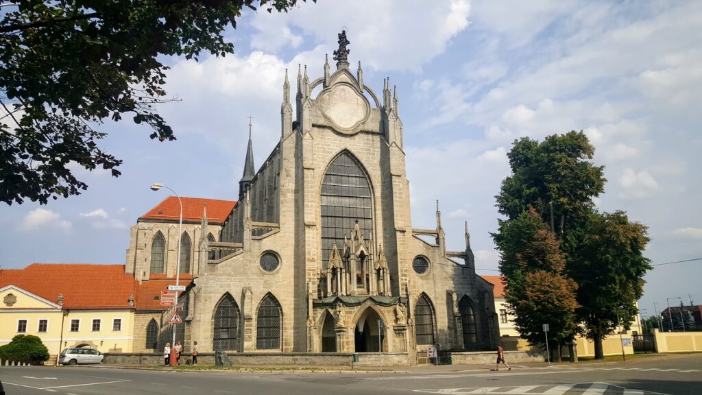A large gothic cathedral with stained glass windows in Kutná Hora called The Church of the Assumption of Our Lady and Saint John the Baptist.