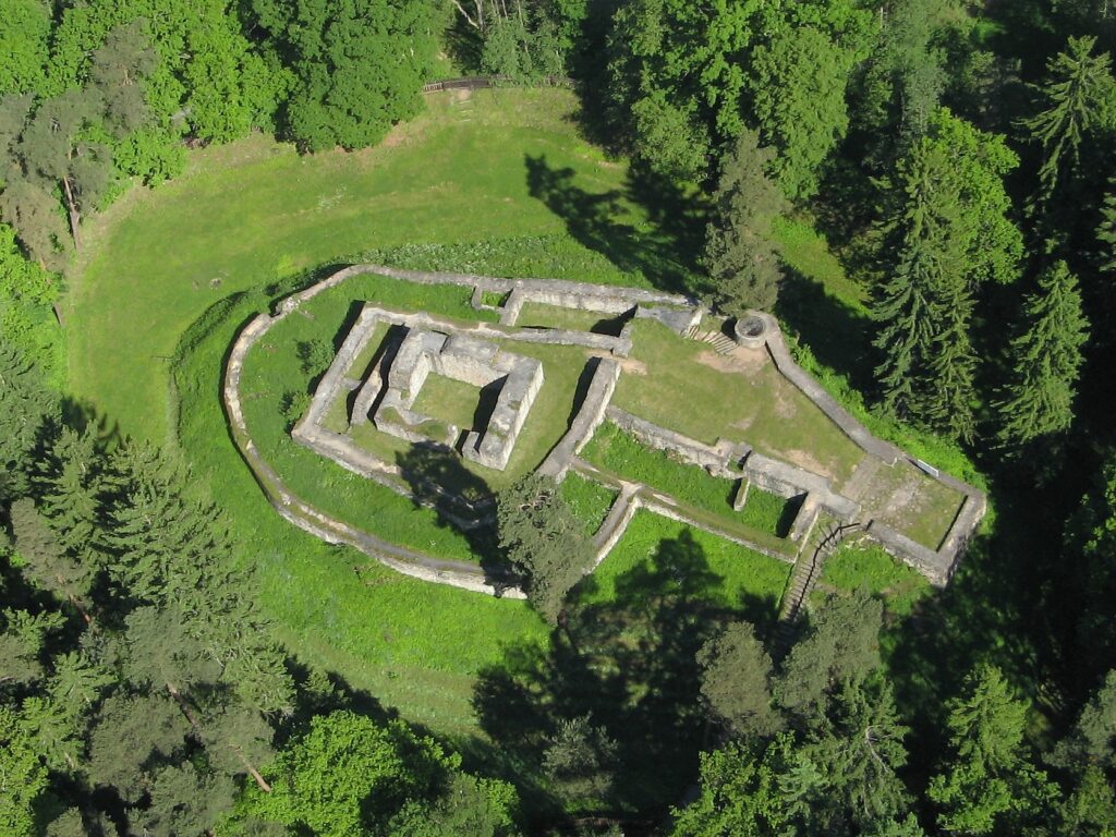 The ruins of Kozí Hrádek can be seen in an aerial picture. they are surrounde by grass and trees. Wheely Tyred Mikulov Top attractions