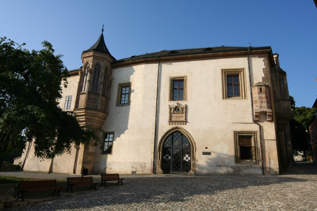 A large white building called the Museum of Silver in Kutná Hora.