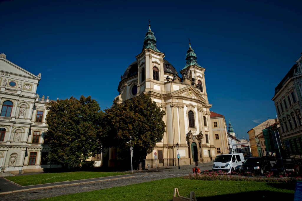 A baroque church towers over a small park Wheely Tyred Kroměříž attractions