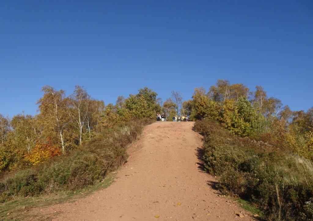 People stand on top of an unassuming hill of slag called Halda Ema, Ostrava