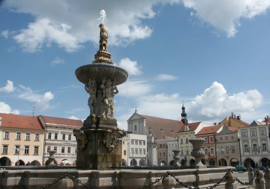The Samson Fountain shows statues of men holding up another man, who is the fountain. It's in Přemysl Otakar II. Square, České Budějovice.