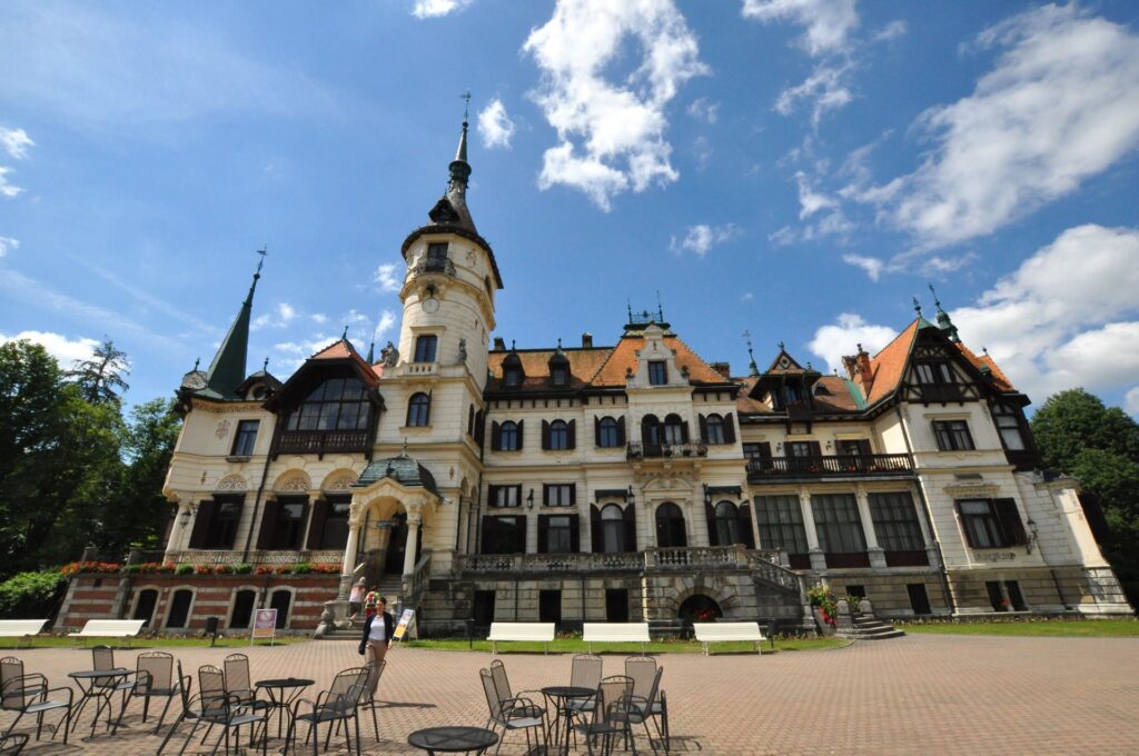 Chateau Lešná in Zlín is a huge, turreted castles with a red roof and cream walls.