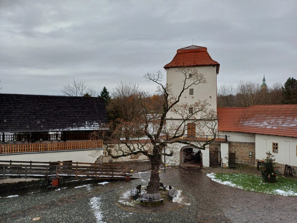 The Silesian Ostrava Castle is a white building with a red roof, perhaps a bit smaller than you'd expect