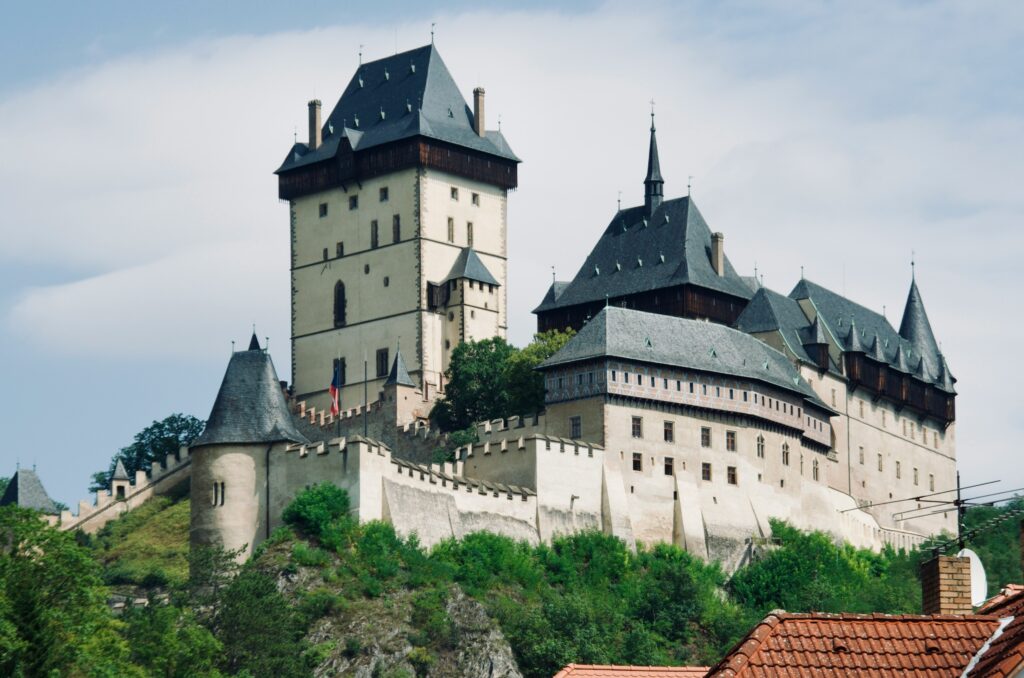 The grand Karlštejn Castle sits on top of a hill near Prague
