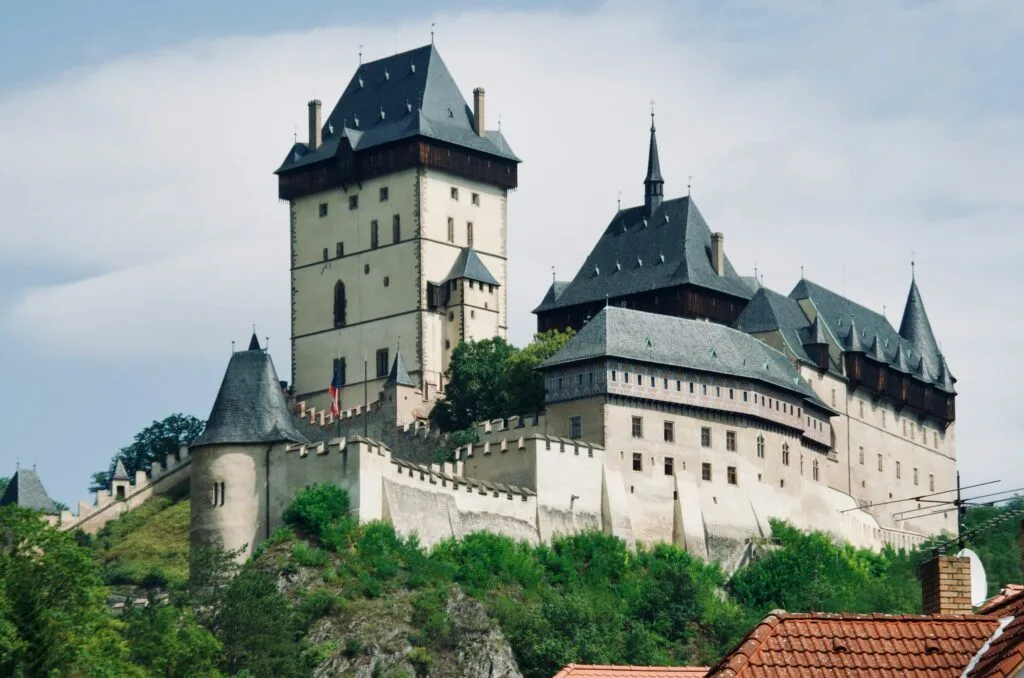 The grand Karlštejn Castle sits on top of a hill near Prague. Wheely Tyred Best time to visit Bohemia