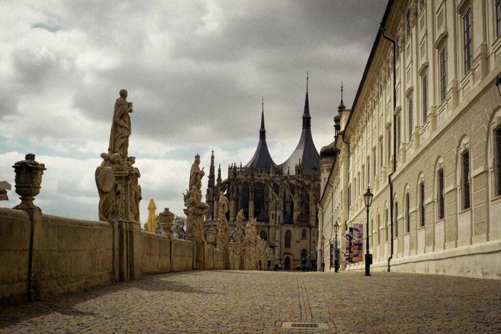 The walkway along the side of the Cathedral of St Barbara is line with gargoyles, in Kutná Hora, Czechia.