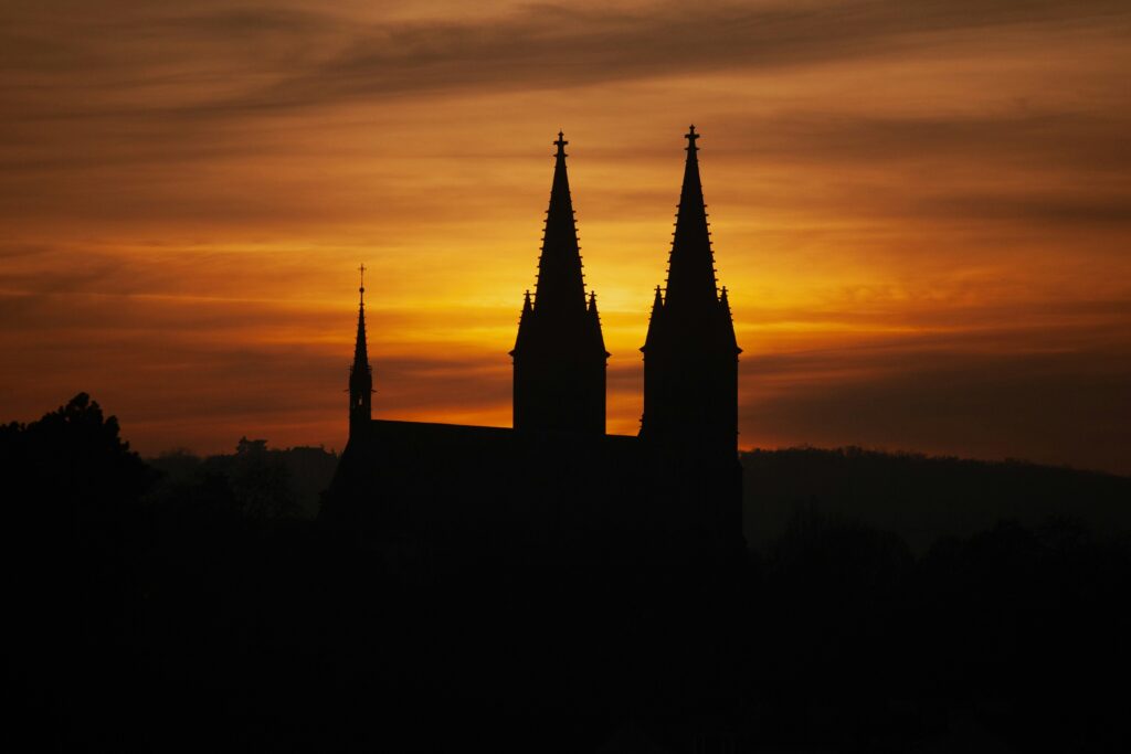 The twin spires of the basilica at Vyšehrad at sunset