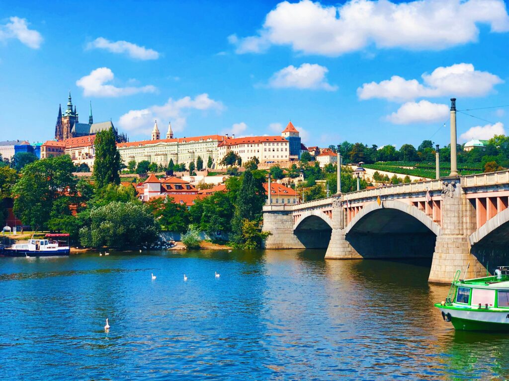 Prague Castle and St Vitus Cathedral can be seen over the River Vltava