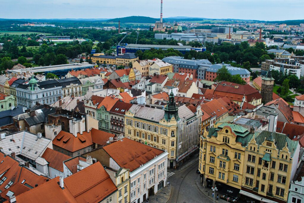 An aerial view of the city of Plzeň, Czechia, showing the Pilsener Urquell Brewery just outside of town.
