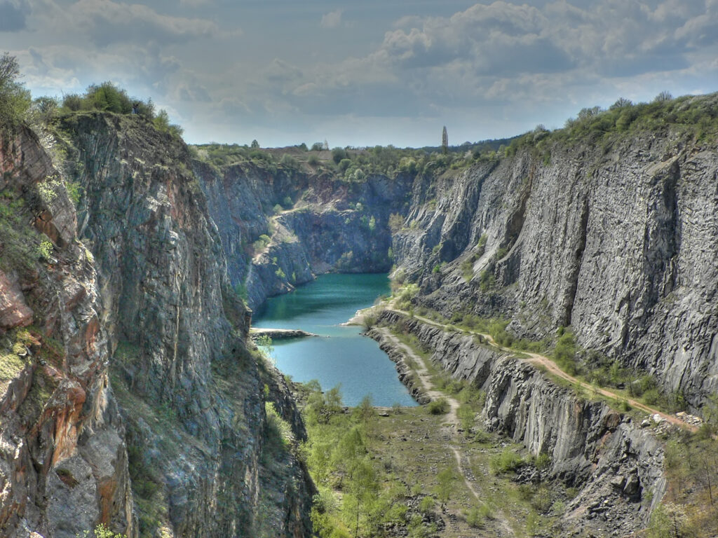 The Velká Amerika quarry is a large, deep guoge in the earth with a lake at the bottom. Wheely Tyred hidden gems in Bohemia