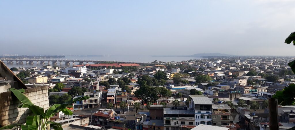 An aerial shot of Duran in Ecuador, woth the Guayas River behind it. Wheely Tyred Guayaquil safety