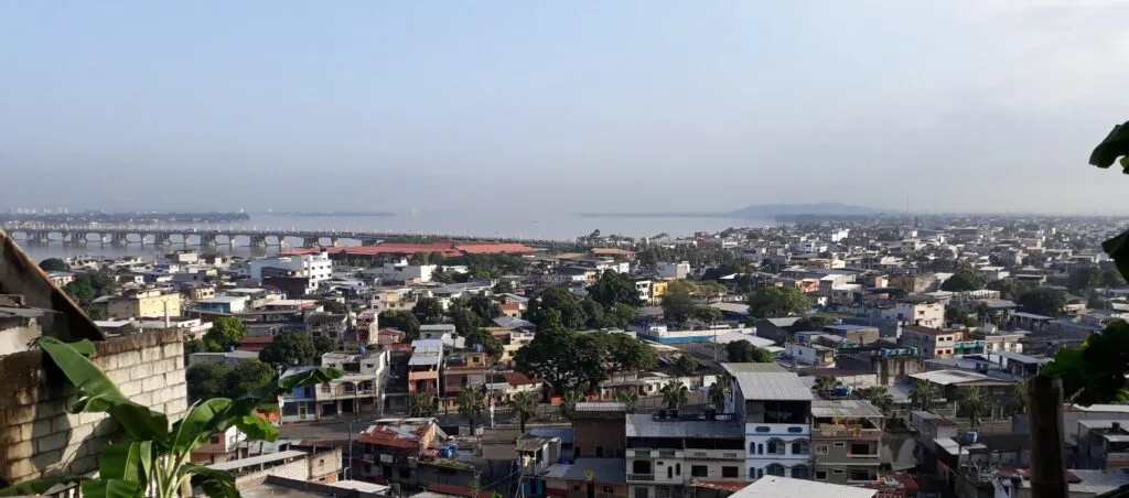 An aerial shot of Duran in Ecuador, woth the Guayas River behind it.