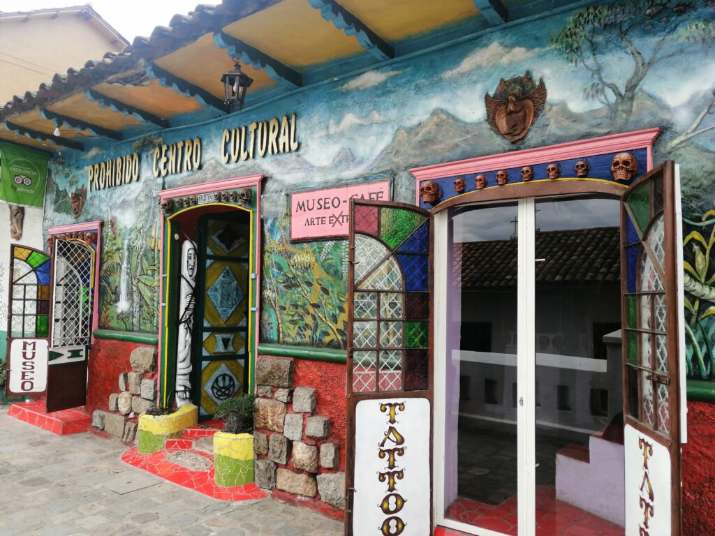 The multicoloured entrance to the Prohibido Centro Cultural in Cuenca, Ecuador, shows devils and demons. 