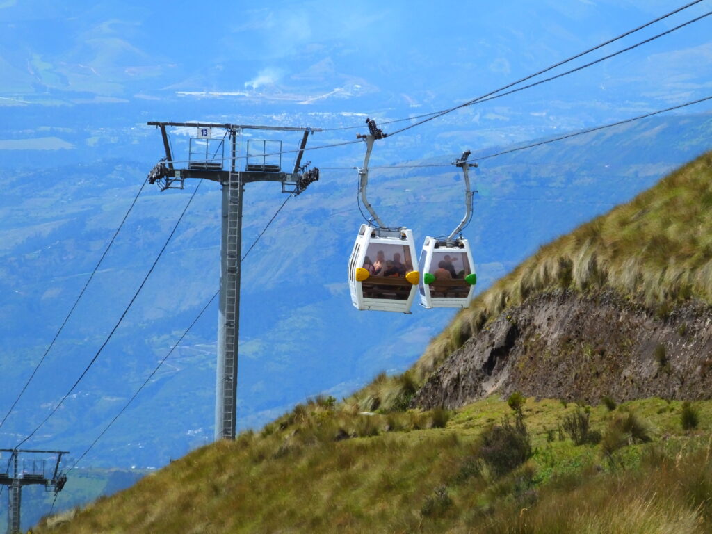 The Gondolas of the TelefériQo in Quito Ecuador, hang as the move.
