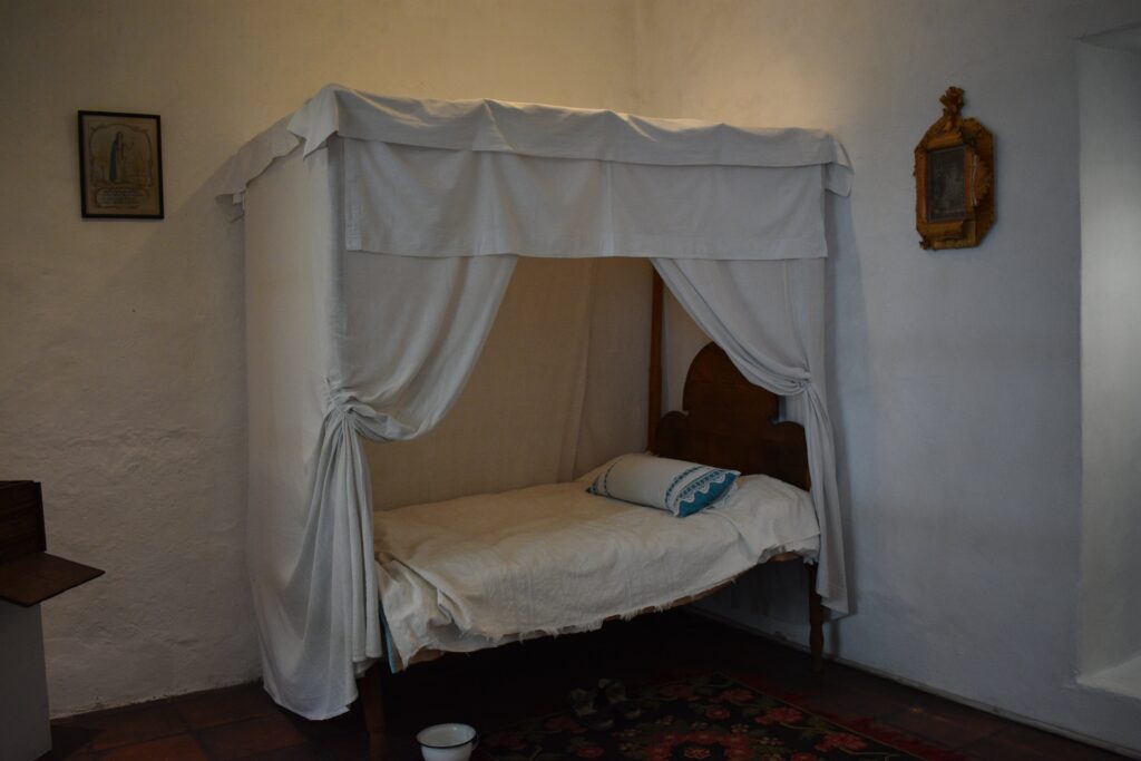 The bed of a nun in a display at Museo de las Conceptas in Cuenca, Ecuador. Wheely Tyred Hidden Gems in Cuenca