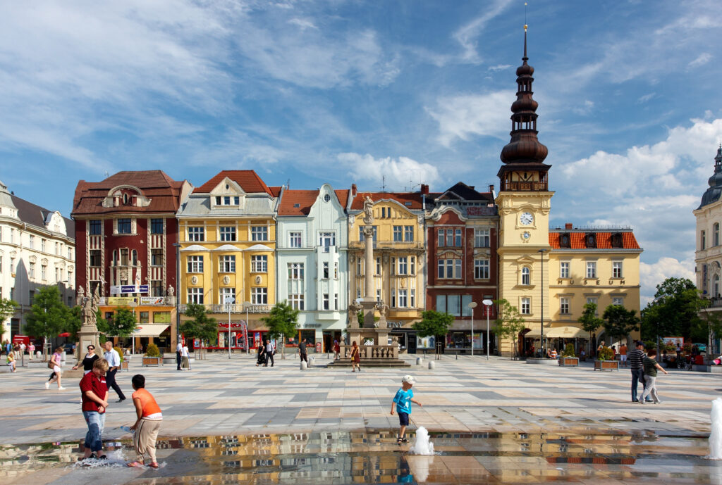 People walk and children play in Masarykovo náměstí in Ostrava, Czechia