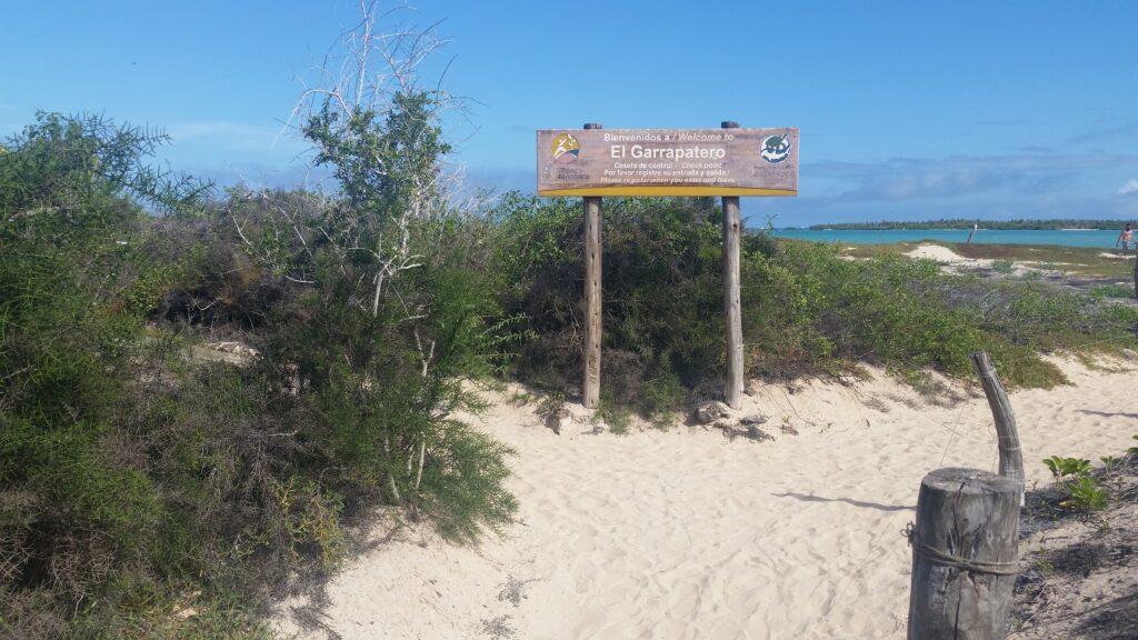 A sign at the entrance to Playa El Garrapatero, reminding people to register. Wheely tyred Galápagos Islands hidden gems