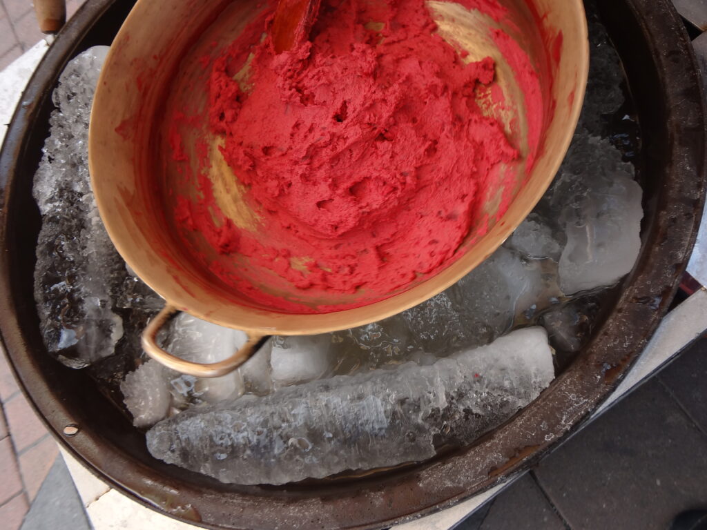 Red Helados de Paila in a copper dish on top of some ice in Ibarra.