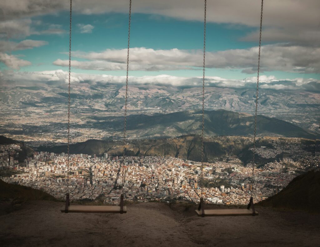 A swing on top of Guagua Pichincha, looking out high above the city of Quito and the Andes.