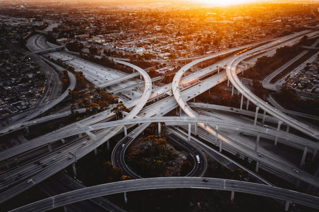 The sun sets over the Judge Harry Pregerson Interchange in Los Angeles.
