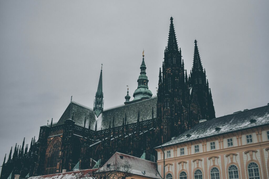 The Cathedral of St Vitus is covered in snow in Prague. Wheely Tyred best time to visit Prague