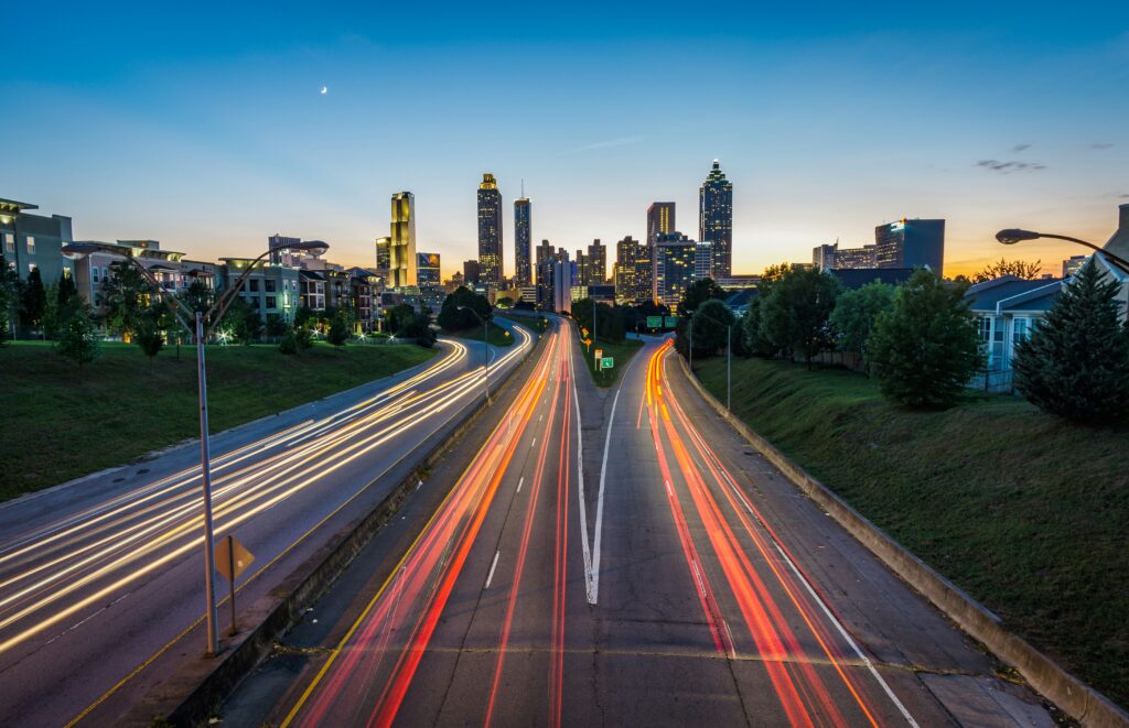 The trails of car lights move along a highway into Atlanta, Georgia.