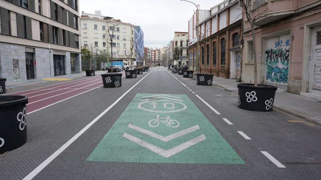 A bike lane runs through a superblock in Barcelona, Spain. Wheely Tyred barcelona beat traffic