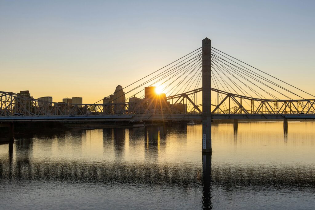 Sunset over downtown Louisville, Kentucky, as seen from the Ohio River. Wheely Tyred Highways Destroyed America