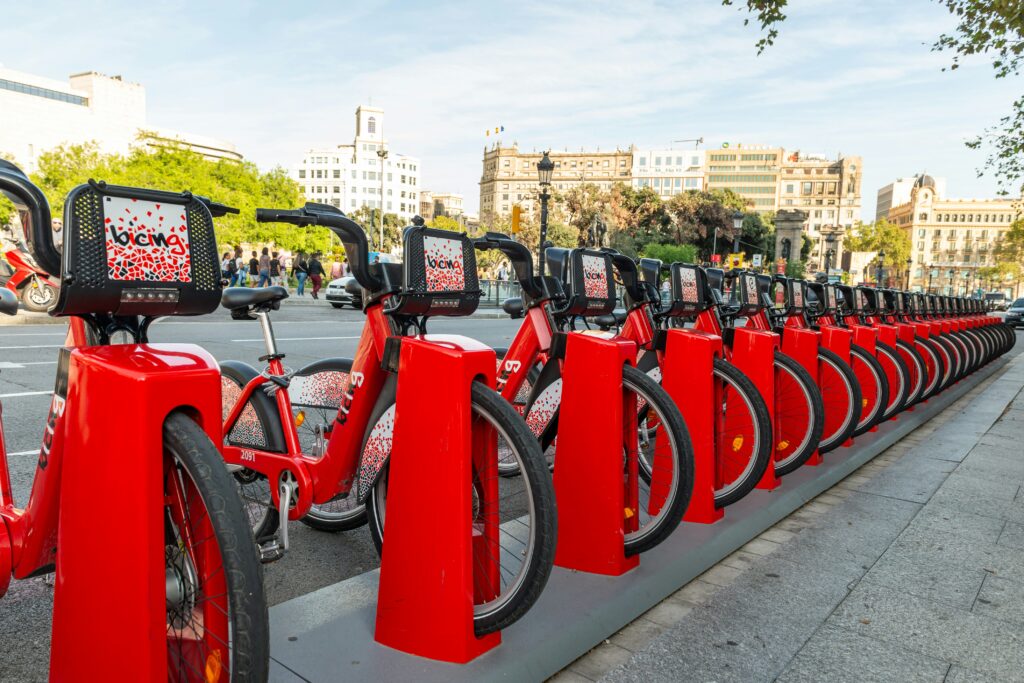 A row of Bicing e-bikes docked in Barcelona, Spain.