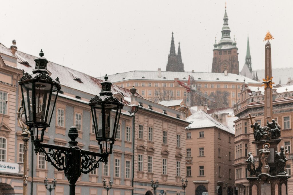 Prague Castle can be seen from Mala Strana. It's snowing heavily.