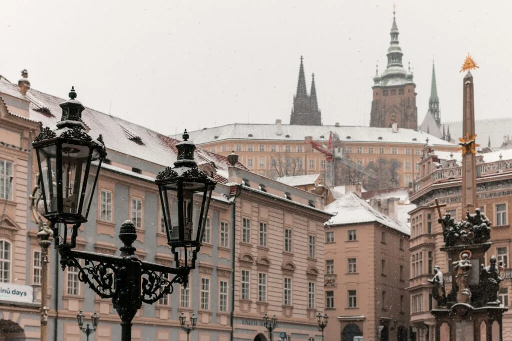 Prague Castle can be seen from Mala Strana. It's snowing heavily.