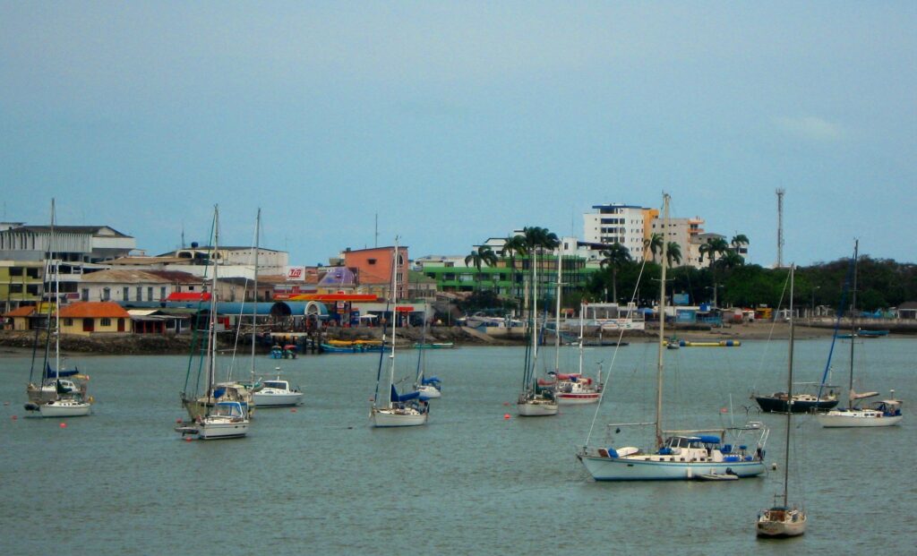Small boats float in the still waters of Bahía de Caráquez, Ecuador. Wheely Tyred hidden gems on the Ecuadorian Coast