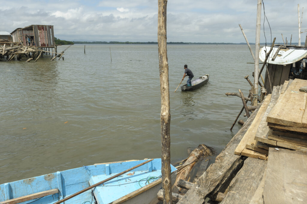 04-29-2016 SAN JOSE DE CHAMANAGA, ESMERALDAS, ECUADOR. Angel Pata, 16, rows his family canoe at the Mache river in San José de Chamanga. The Pata family  engaged in fishing for living. An earthquake hit the place on April 16 destroying several houses and public edifications.