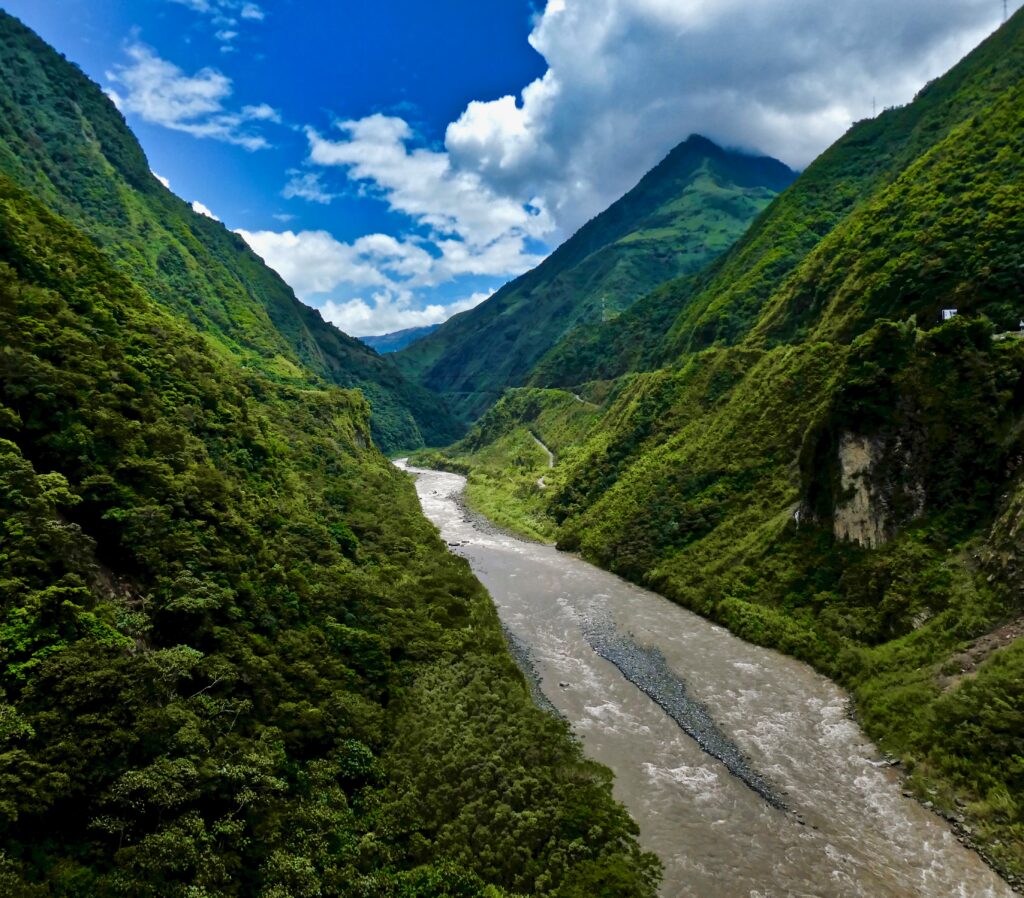 The Psataza River flows through a huge wodded valley in Ecuador.
