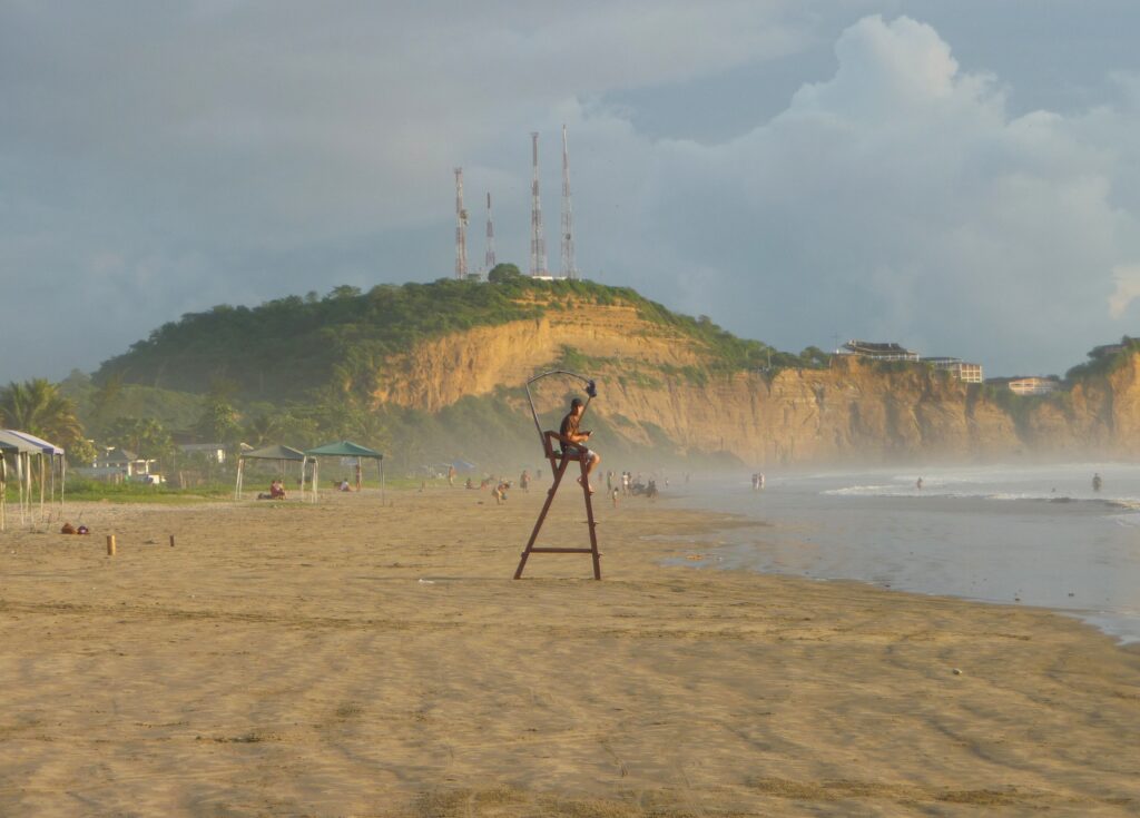 A lifeguard watches people play on Playa Olón, Ecuador.