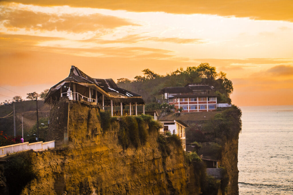 The Santuario Blanca Estrella Del Mar rises above the ocean on a cliff in Olón, Ecuador.