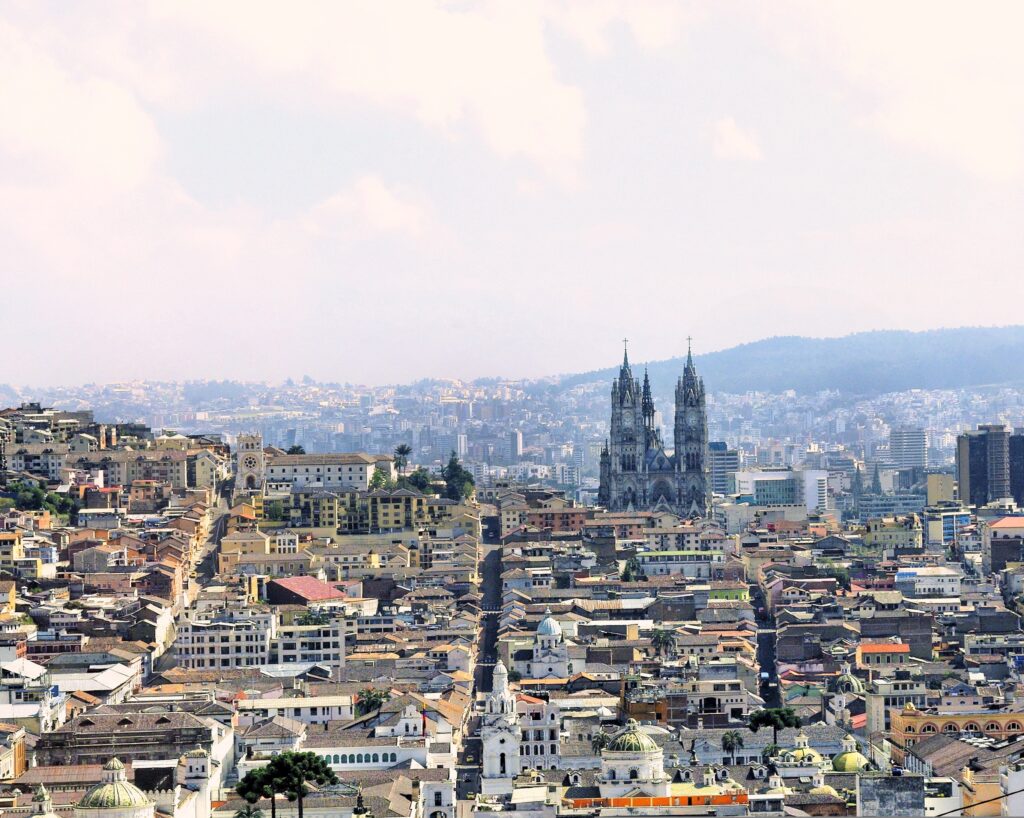The Basílica del Voto Nacional is seen rising above Quito, Ecuador, from a distance.