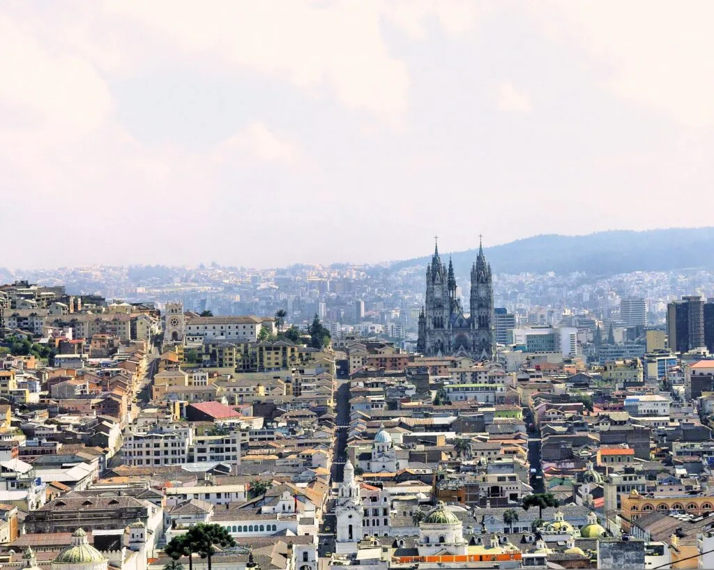 The Basílica del Voto Nacional is seen rising above Quito, Ecuador, from a distance.