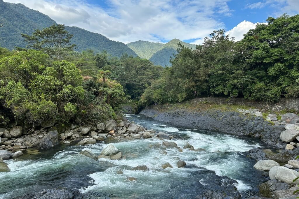 The Rio Negro flows through the mountainous forests in Ecuador. Wheely Tyred Baños boat tours