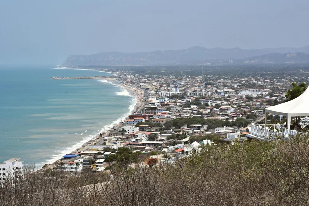 The pacific ocean meets the shore along a beach town in Ecuador. Wheely Tyred Top restaurants in Montañita