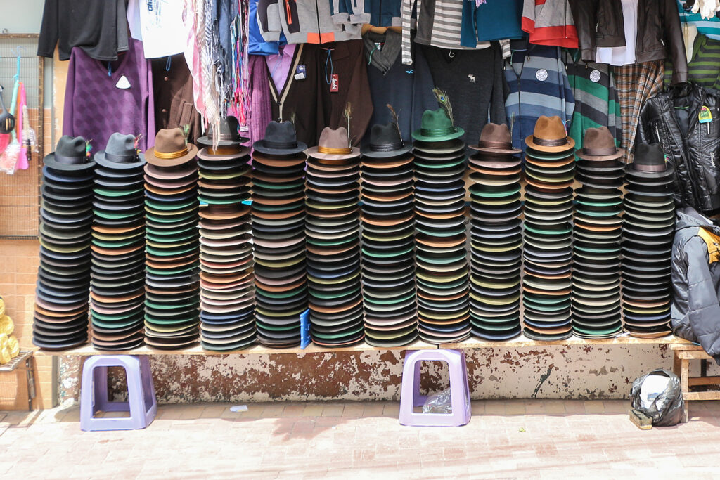 Panama hats are neatly piled outside of a shop in Alausí, Ecuador
