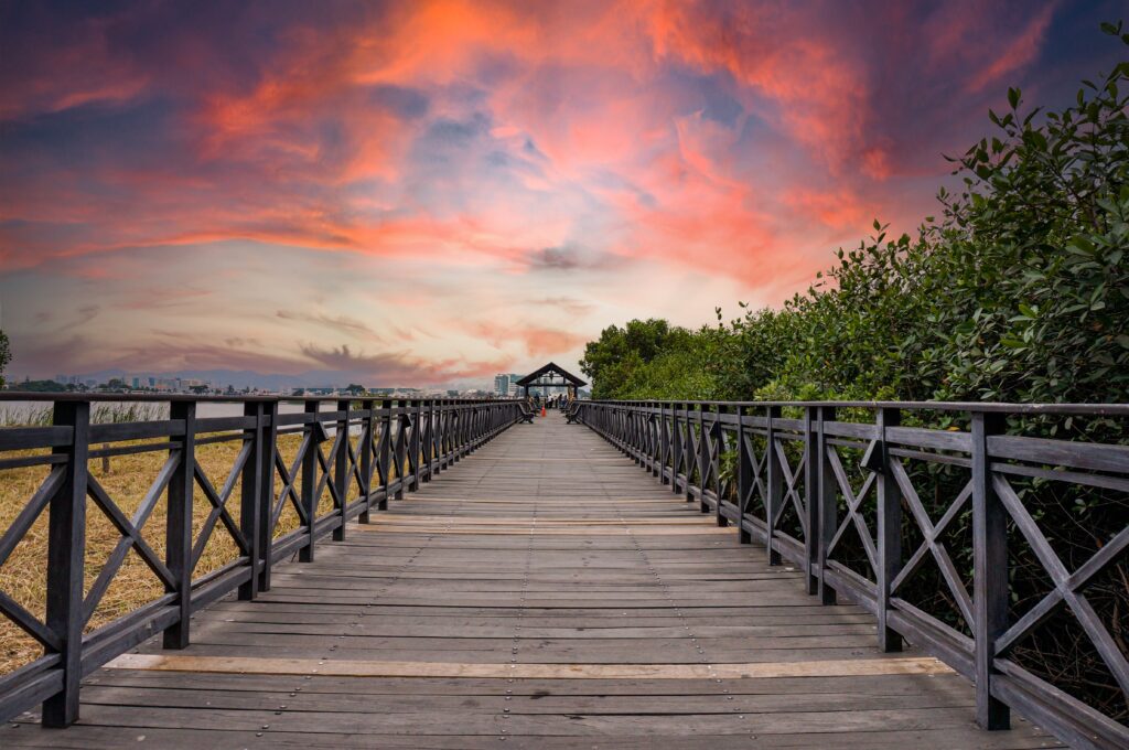 A boardwalk stretches into the sunset in Guayaquil, Ecuador.