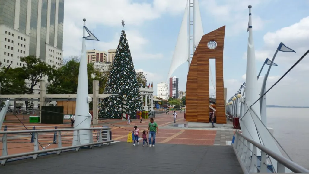 People walk along the Malecon 2000 by the River Guayas in Guayaquil, Ecuador.