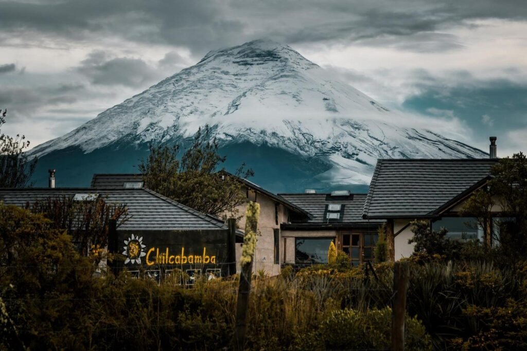 Cotopaxi is huge in the background of Chilcabamba Lodge