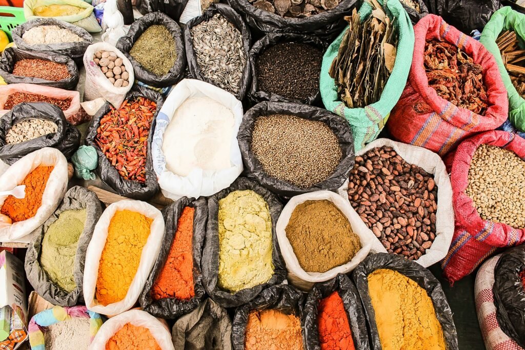 Multi-coloured bags of herbs and spices in the Plaza de Ponchos market in Otavalo, Ecuador.