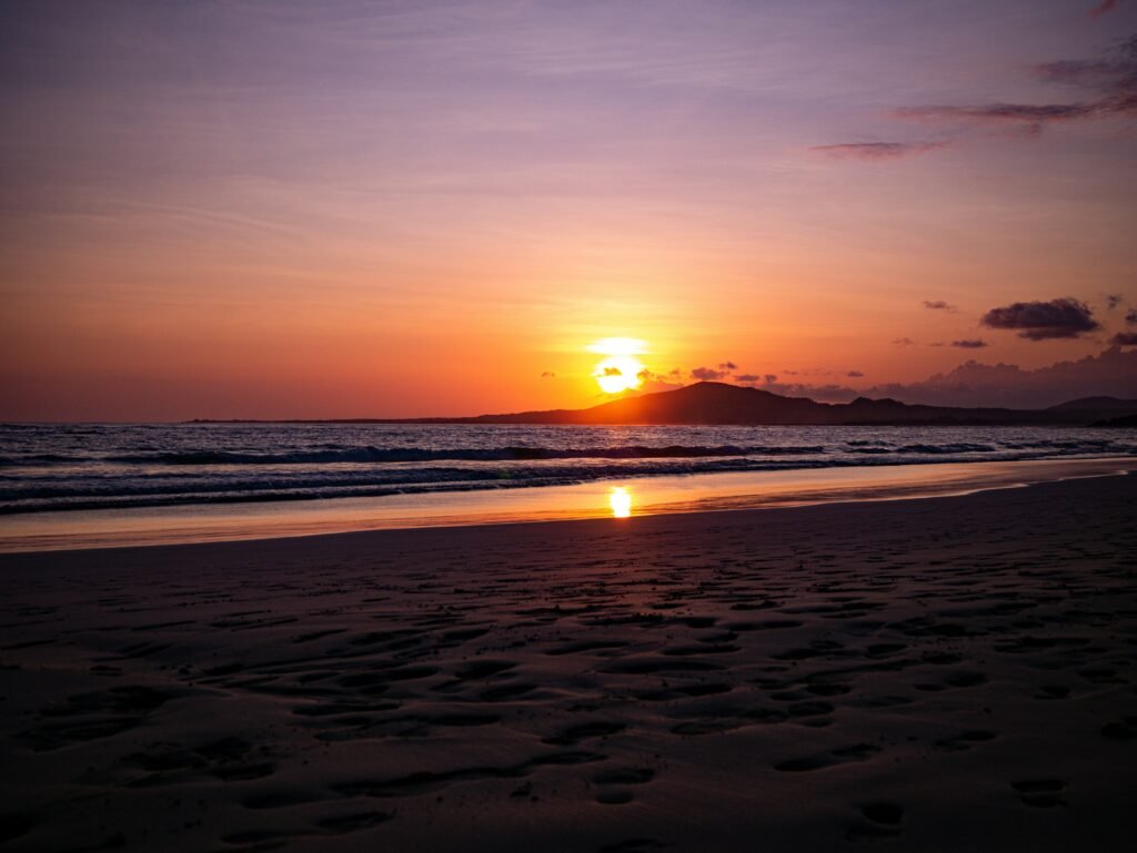 Sunset over Isla Isabela, Galápagos, from the beach.