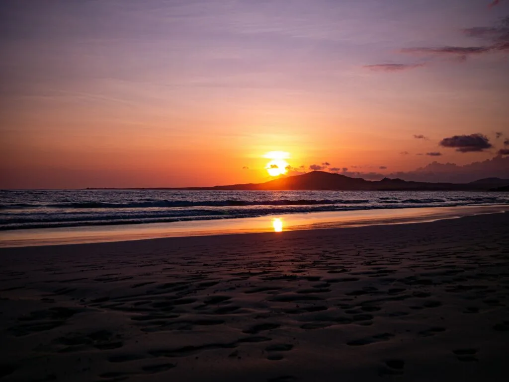 Sunset over Isla Isabela, Galápagos, from the beach.
